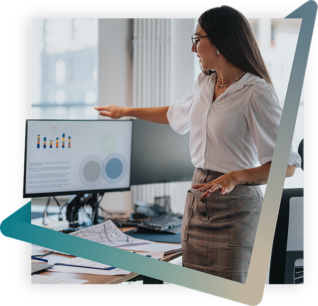 Person pointing to information on a computer screen.